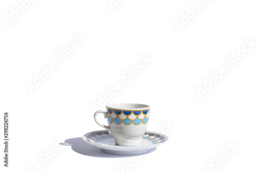 white tea cup with cropped color details on white background