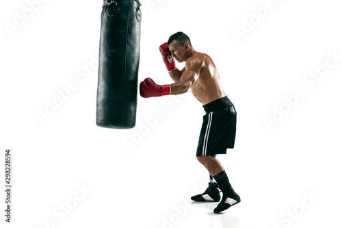 Full length portrait of muscular sportsman with prosthetic leg  copy space. Male boxer in red gloves training and practicing. Isolated on white studio background. Concept of sport  healthy lifestyle.