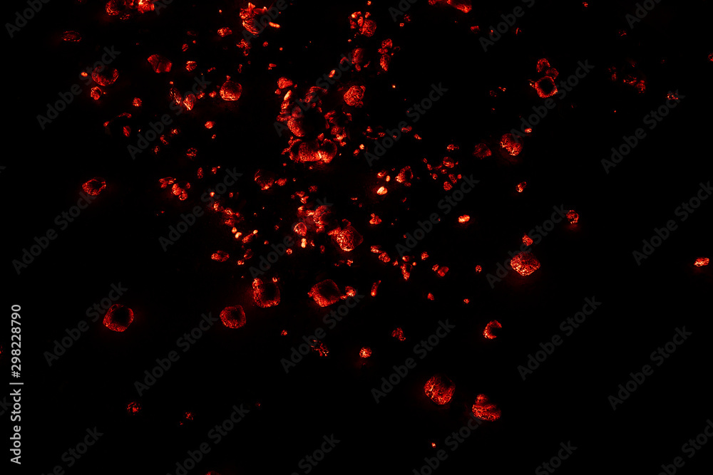 Burning hot red charcoal briskets on the ground Burning hot red charcoal briskets on the ground