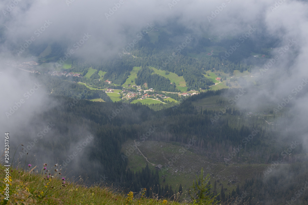 Fototapeta premium View from the Watzmannhaus through some clouds on Ramsau