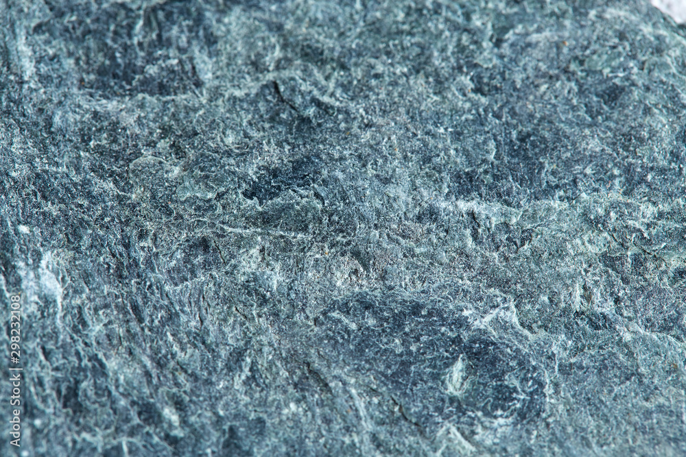 Obraz premium Grainy texture of greenish-gray natural stone. Natural backgrounds and textures.