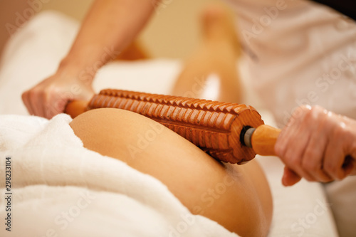 Close-up of anti cellulite massage at the spa. photo