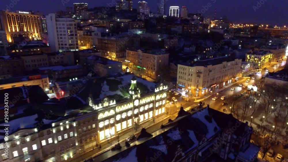 Aerial night Vladivostok city old modern building cityscape centr street Illumination. Russia Asia. Road traffic cars. Cinematic evening. Winter frozen snow ice. Drone above Aerial night Vladivostok city old modern building cityscape centr street Illumination. Russia Asia. Road traffic cars. Cinematic evening. Winter frozen snow ice. Drone above