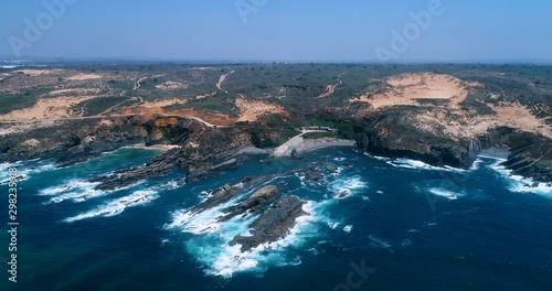 Aerial view of the coastline and fishing port near the Almograve beach, in Alentejo, Portugal