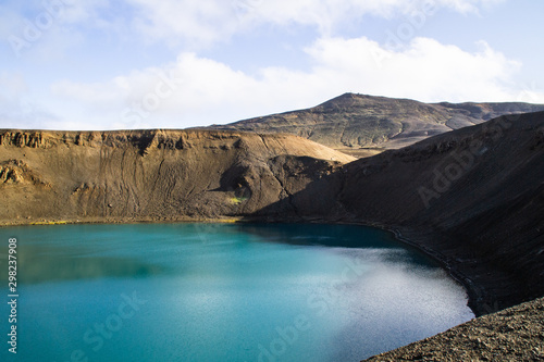 View of Krafla volcano crater with water, tourist popular attraction in Lake Myvatn, Iceland