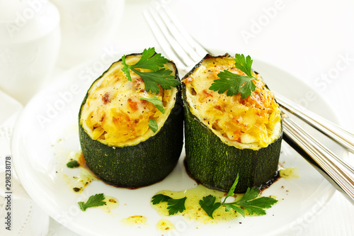Baked zucchini stuffed with rice and vegetables.