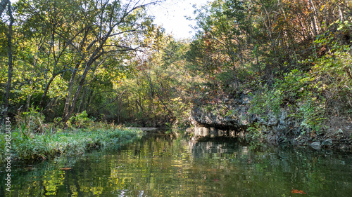 Fototapeta Naklejka Na Ścianę i Meble -  Missouri lake with rocks and trees, autumn reflections