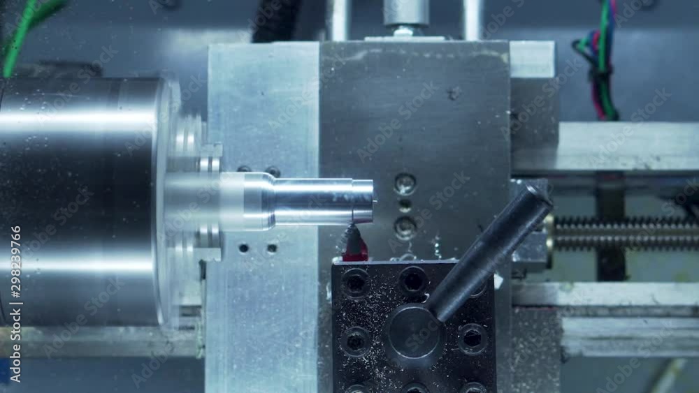 Desktop CNC lathe cutting chess pawn out of aluminum stock 15 second time lapse close up Desktop CNC lathe cutting chess pawn out of aluminum stock 15 second time lapse close up