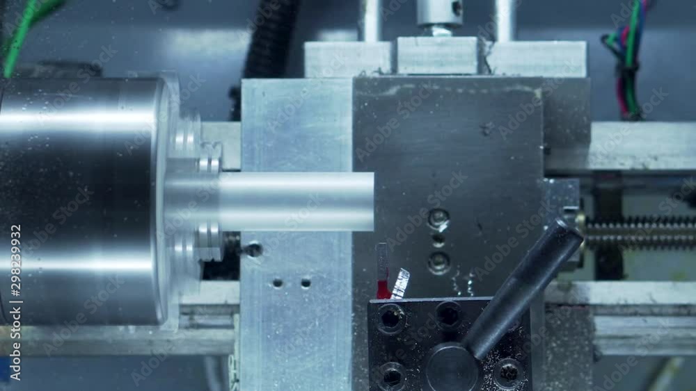 Desktop CNC lathe face cutting aluminum stock close up Desktop CNC lathe face cutting aluminum stock close up