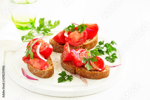 Bruschetta with tomatoes and onions. Selective focus