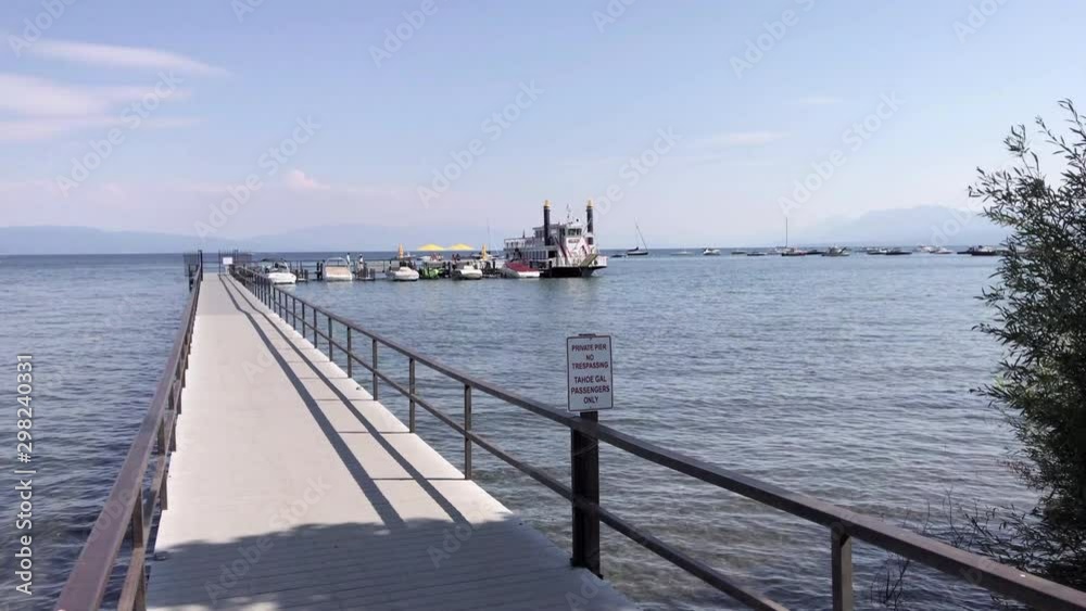 A pier extending to a paddle-wheeler on Lake Tahoe. A pier extending to a paddle-wheeler on Lake Tahoe.