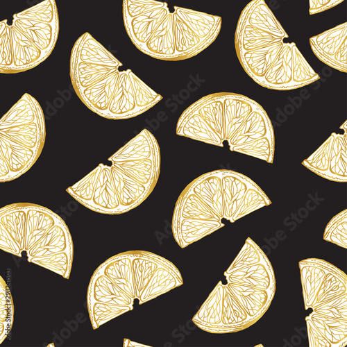 Golden lemon slices on a dark background