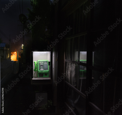 Old street phone booth in Japan, screen and dial, night scene 