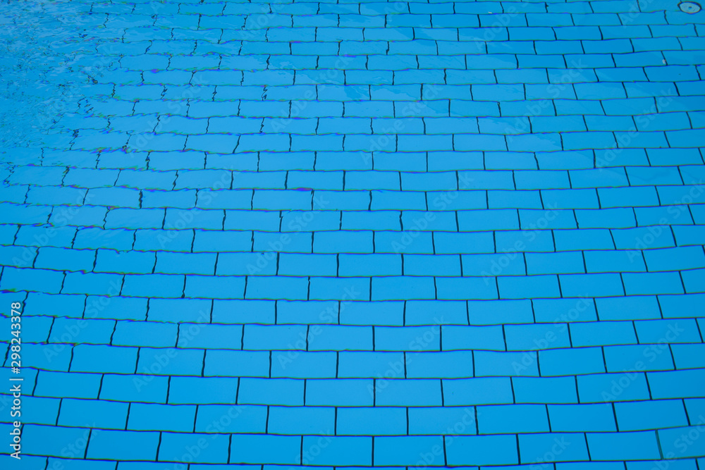 blue bottom of the pool. Pool water top view, rectangular pool tile
