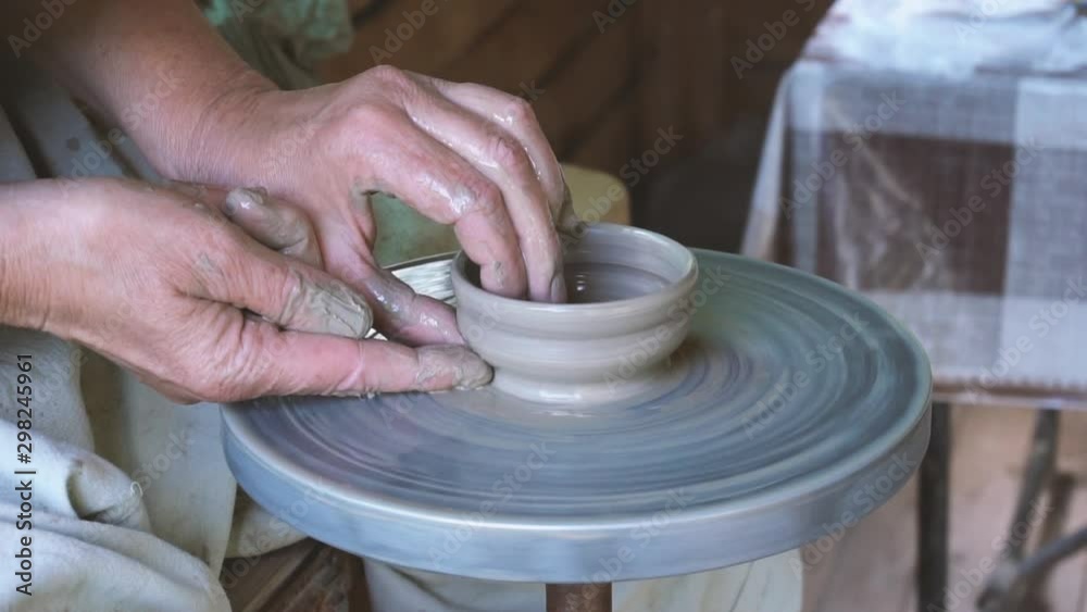 Making cup on pottery wheel in slow motion Making cup on pottery wheel in slow motion