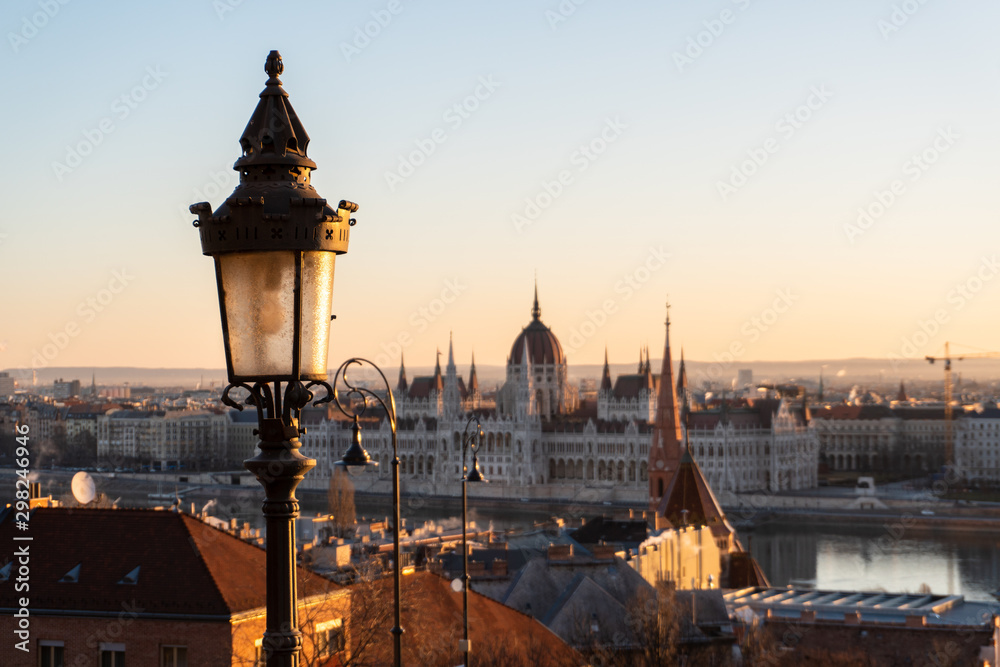 Street lamp in focus and Hungarian parliament in the background