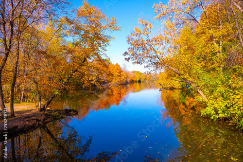 Golden autumn park Autumn forest lake water landscape  Forest lake in fall  USA 