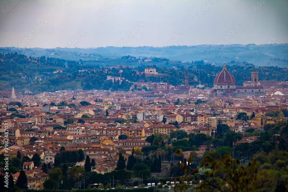 Panoramic view of Florence, Tuscany region city in Italy. Red roofs and Cathedral spire. Beautiful cityscape from the top.