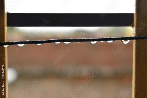 Close up of water drops on a rope with blur background