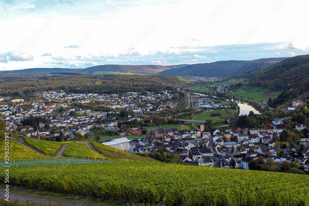 View on the Saar river and Saarburg town from vineyards hills near Saarburg, West Germany. October, autumn. 