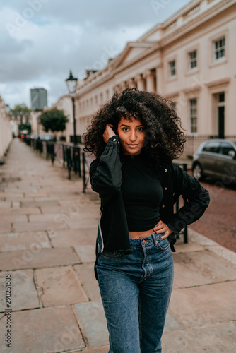 Portrait Charming Young African Woman with Curly Hair, Street Style