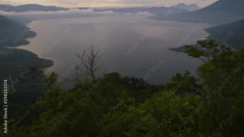 Pov view of lake atitlan from indian nose at sunrise, tilt up 4k Pov view of lake atitlan from indian nose at sunrise, tilt up 4k