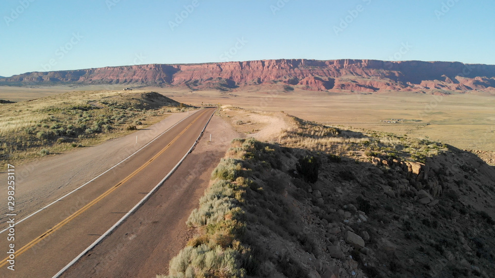 Aerial view of canyon mountains and road, drone perspective