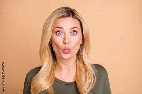 Close up photo of pretty cute attractive nice girl kissing you with green astonishment on face isolated beige pastel color background