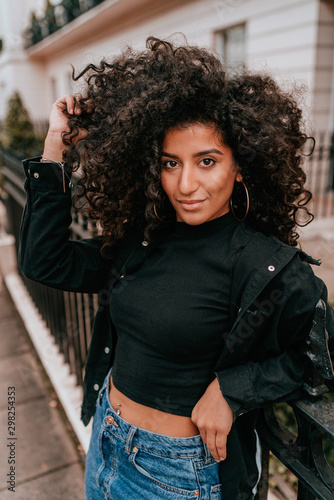 Portrait Charming Young African Woman with Curly Hair, Street Style