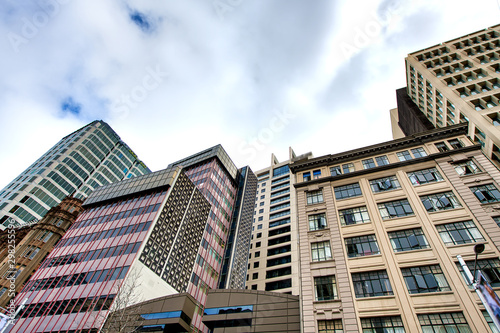 Street view of Auckland buildings in downtown on a cloudy day  New Zealand