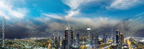 Panoramic aerial view of Dubai skyline from helicopter at sunset, United Arab Emirates © jovannig