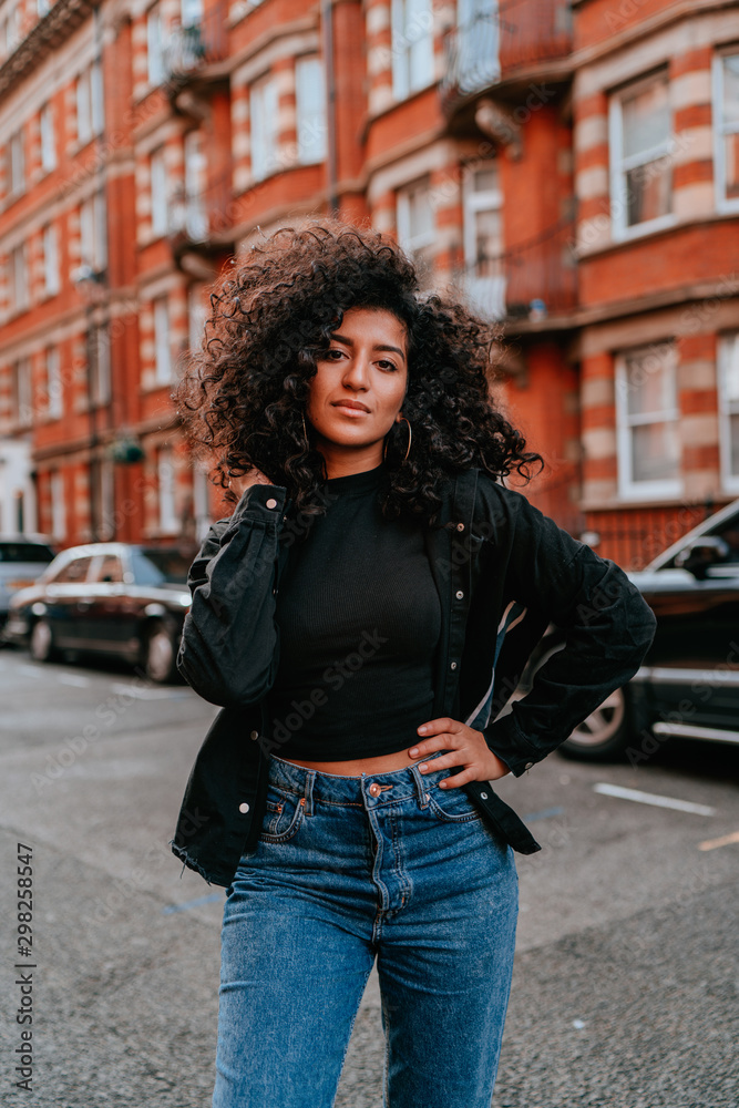 Portrait Charming Young African Woman with Curly Hair, Street Style