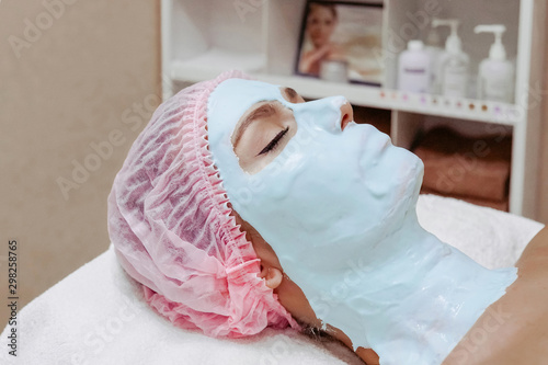  Beautiful woman in a beauty salon, face mask, alginate mask, moisturizing mask, face care, anti-aging mask, natural mask, cosmetologist, cosmetology
