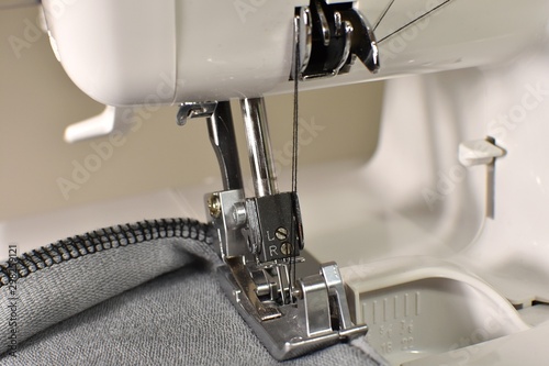 Sewing machine, overlocker, serger close up view, overlock seam. photo