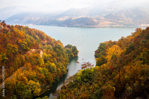 Autumn morning on the river surrounded by mountains. Danube river in Djerdap national park in Serbia on Romanian Border.