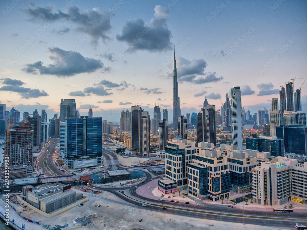Obraz premium Downtown Dubai at sunset, UAE. Amazing aerial view from drone