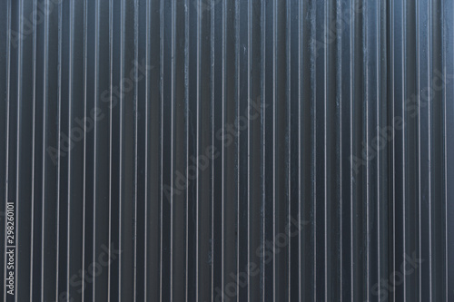 Dark grey colourbond sheet metal fencing background texture photo