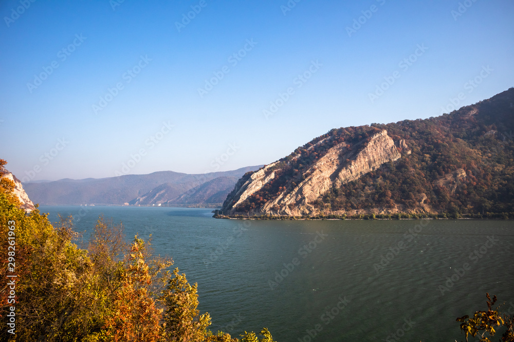 Autumn morning on the river surrounded by mountains. Danube river in Djerdap national park in Serbia on Romanian Border.