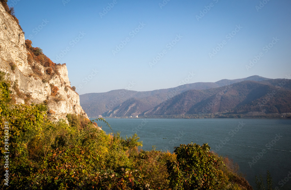 Autumn morning on the river surrounded by mountains. Danube river in Djerdap national park in Serbia on Romanian Border.