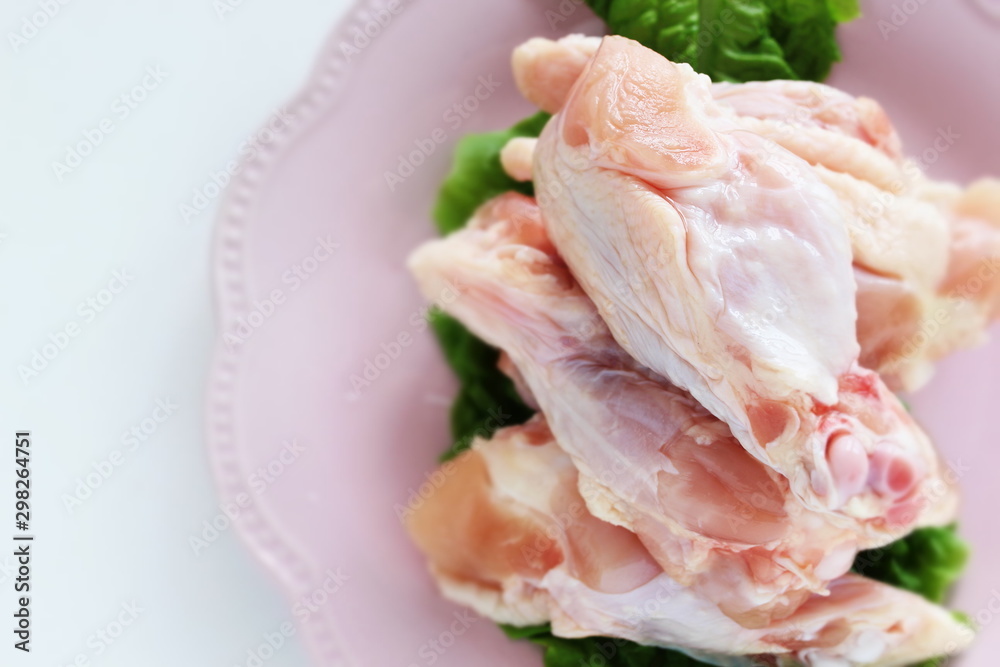 freshness chicken wing on pink dish freshness chicken wing on pink dish