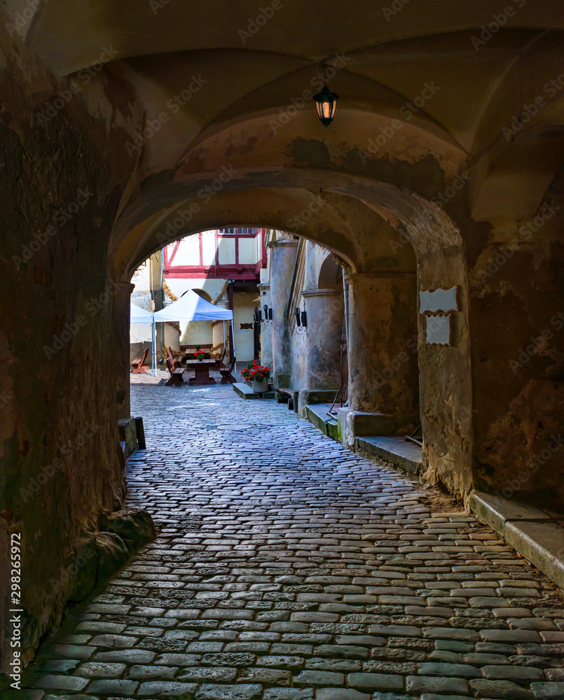 Ancient narrow street  in old medieval town 