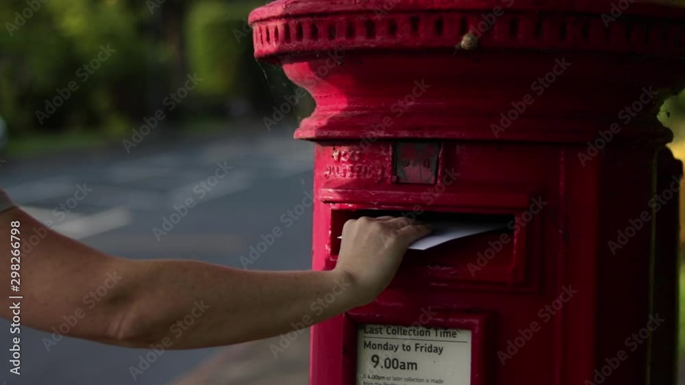 Posting Letter Into English Red Post Box By Road White Female 