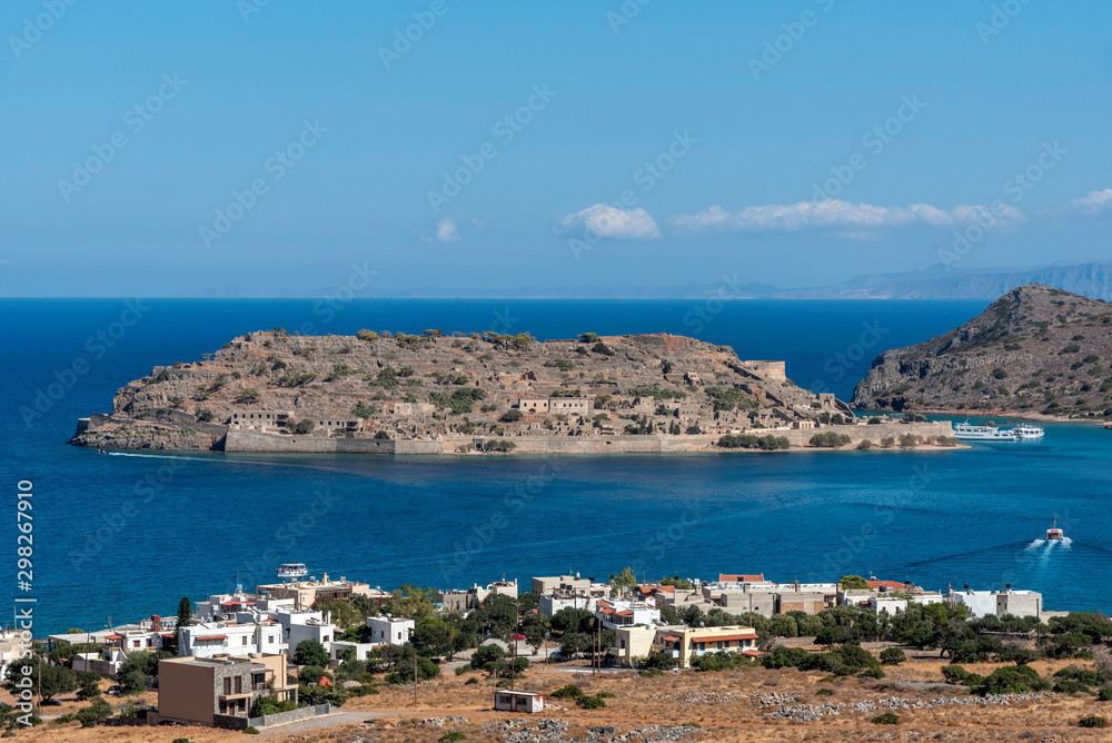 Spinalonga Island, northern Crete, Greece, October 2019. The former leper colony of Spinalonga Island viewed fron the coastal town of Plaka,