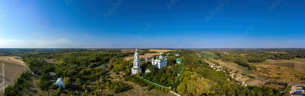 Aerial panorama view of Orthodox Monastery With Green Domes in Ukraine.