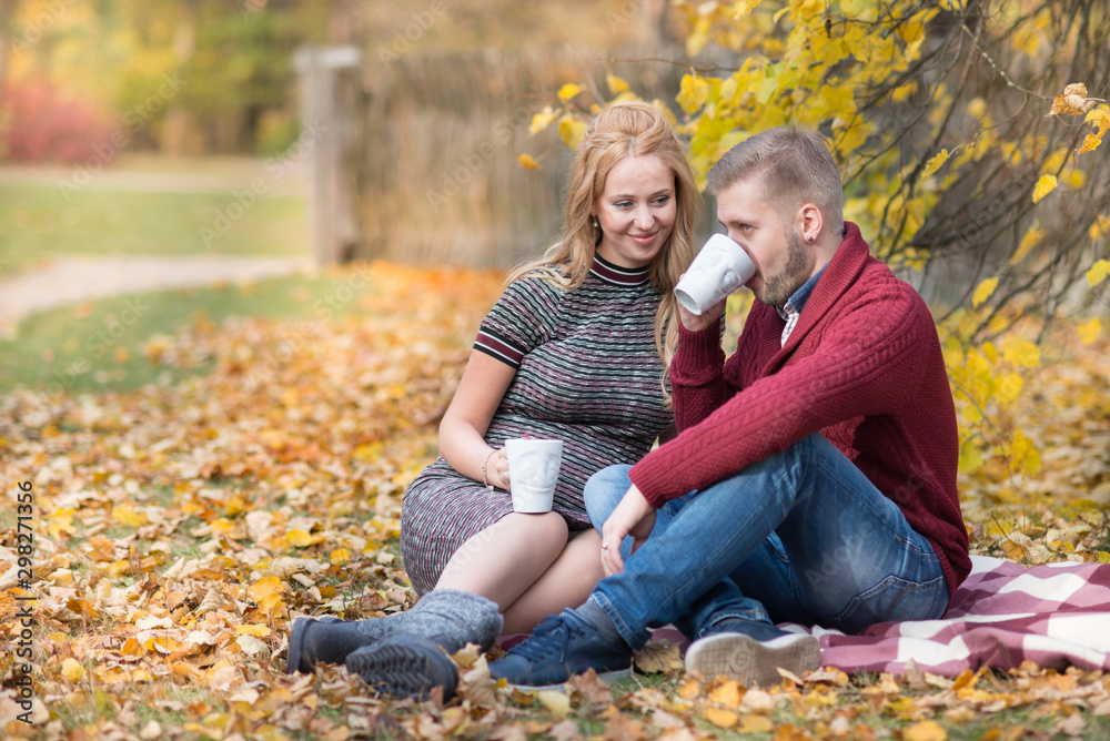 A portrait of young married couple expecting a baby