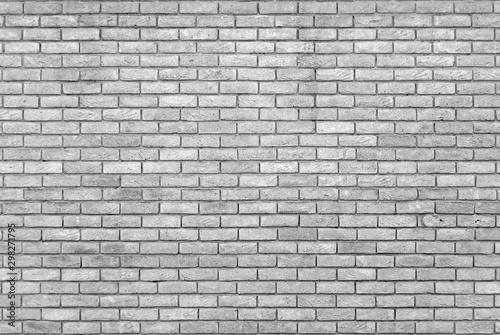 monochrome grey brick wall with repeating pattern photo