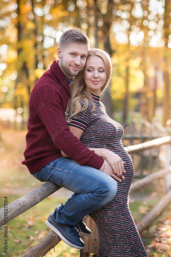 Fototapeta premium A portrait of young married couple expecting a baby