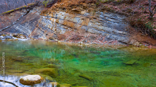 calm emerald mountain river scene