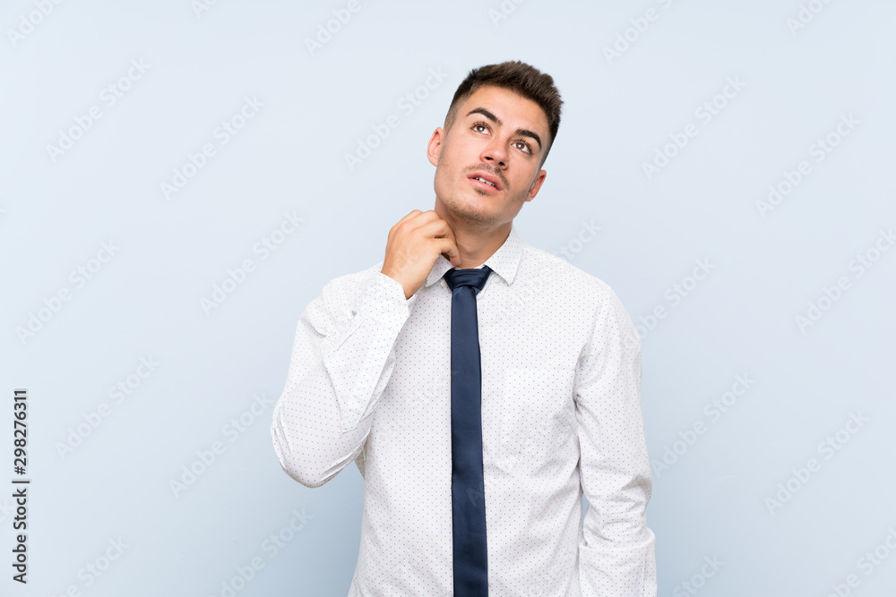 Handsome businessman over isolated blue background thinking an idea Handsome businessman over isolated blue background thinking an idea