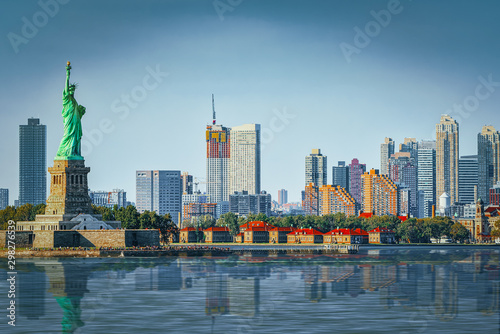 Statue of Liberty on Liberty Island on the background New York Harbor and New York City. © BRIAN_KINNEY